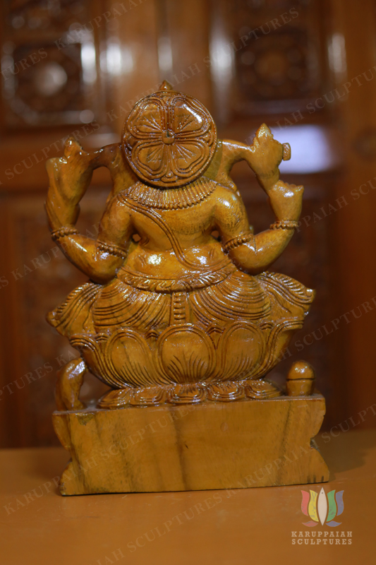 Wooden Vinayagar Statue Seated Holding modak sweet
