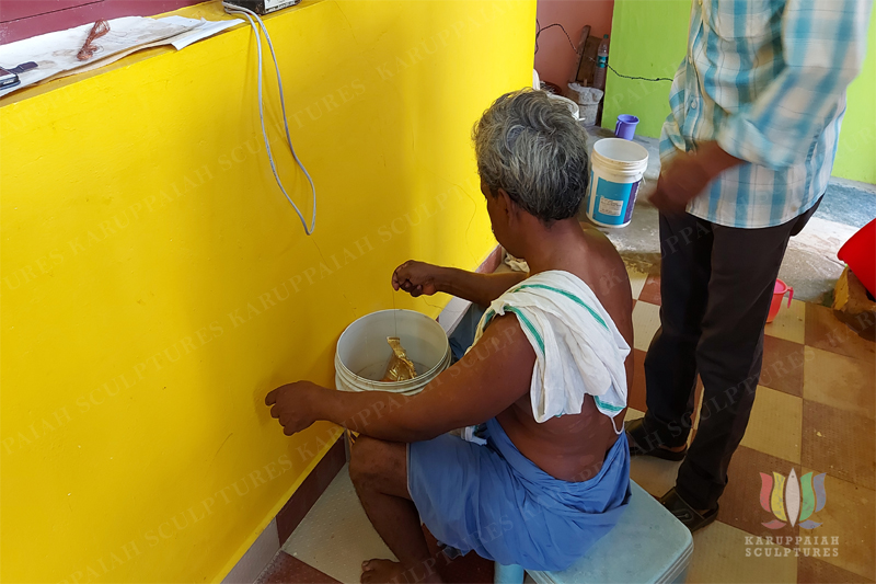 Karuppaiah Achchariyar Giving Electro-Gold Plating To The Silver Kavacham